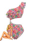 Maillot de bain rose asymétrique motif fruits volants et découpes années 80