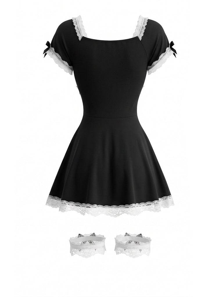 Robe courte noire costume de soubrette en dentelle à nœud et jarretelles années 1980