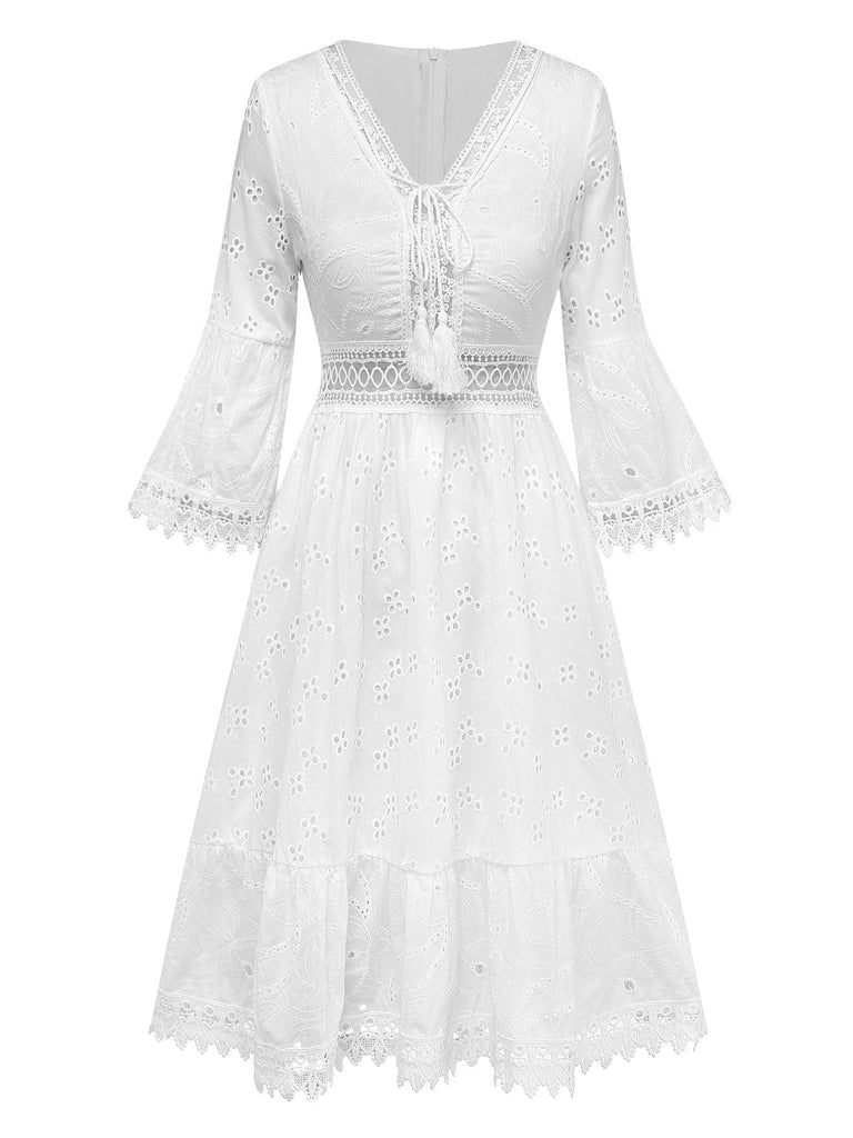 White lace dress with bell sleeves on a white background
