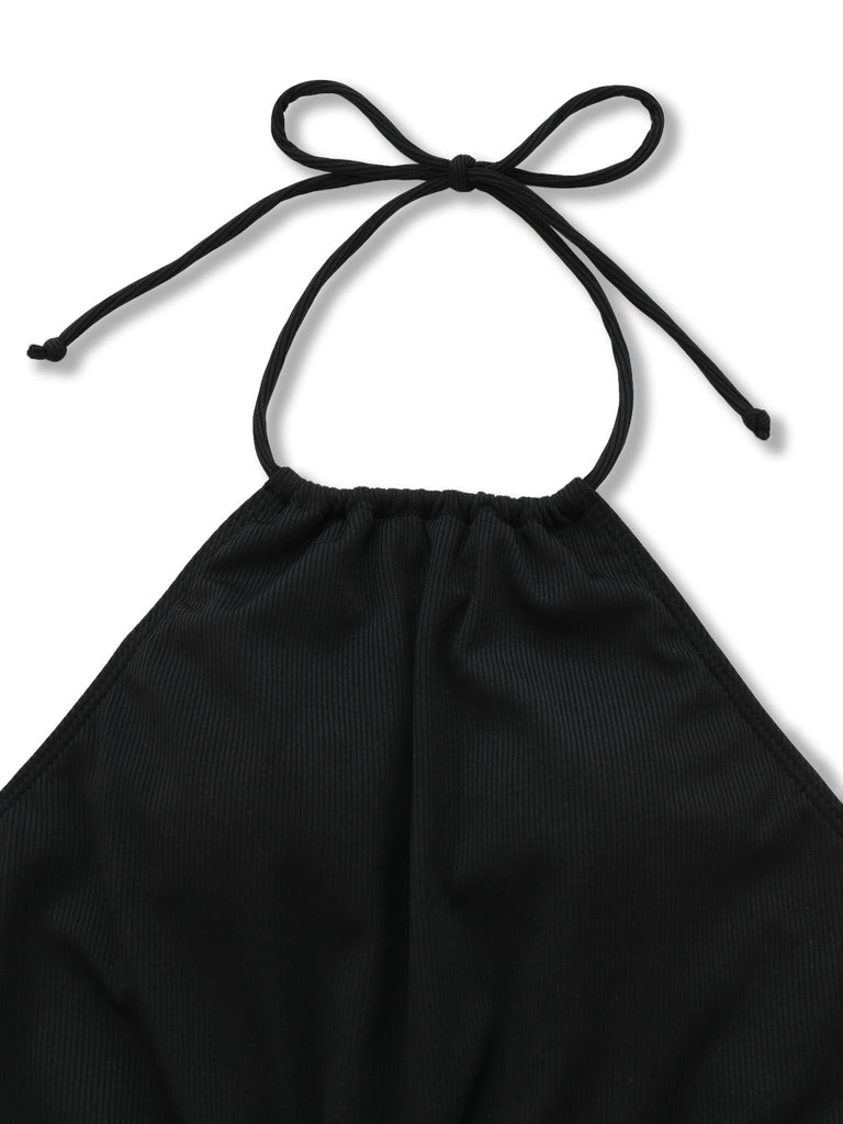 Black halter top with a bow on a white background