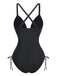 Rear view of the black one-piece swimsuit highlighting the elegant cross-back strap design and full coverage bottom.