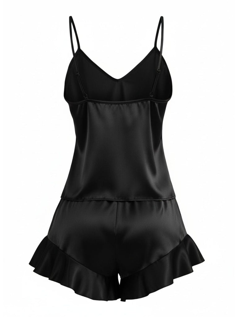 Back view of the black satin pajama set on a white background, showcasing its sleek and glossy texture.