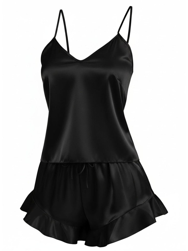 The two-piece silky satin cami and shorts set shown in classic black with feminine ruffle details.