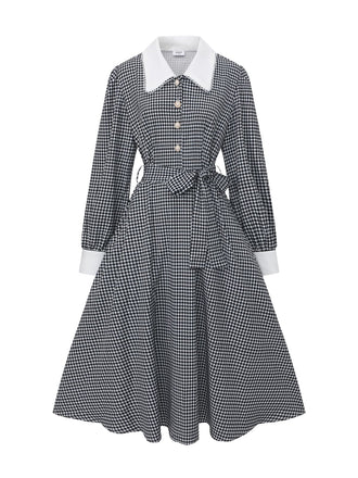 Robe noire à manches bouffantes et boutons nacrés style pied-de-poule années 1940
