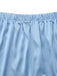 Close-up of the stretchy elastic waistband and fine stitching on the silky satin shorts.