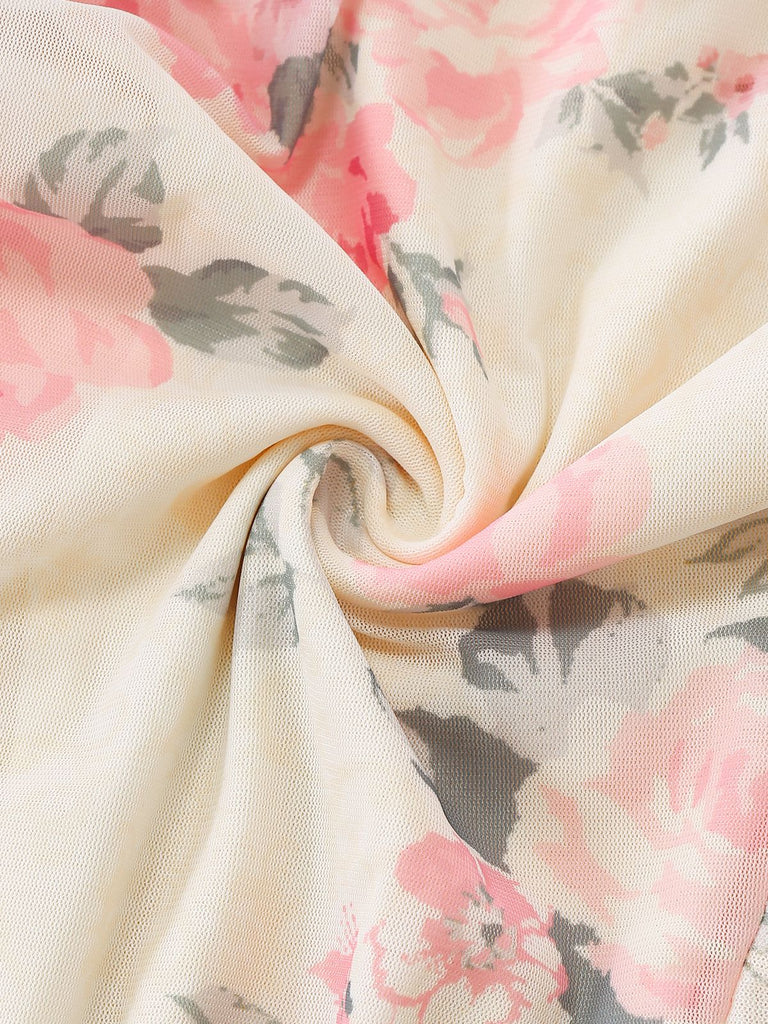 A swirled close-up of the cream fabric highlighting the soft texture and detailed rose print.