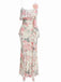 Front studio view of the floral maxi dress highlighting the elegant ruffled overlay and slim-fit silhouette.