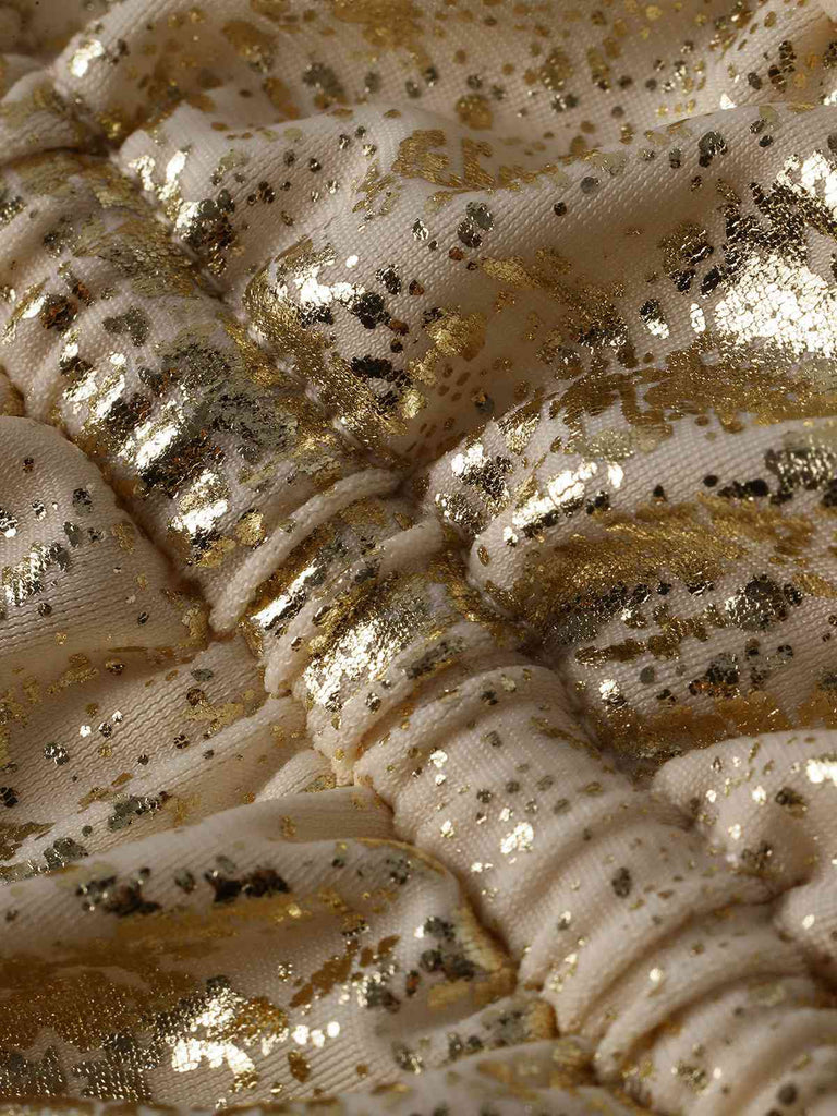 Close-up of gold and white textured fabric