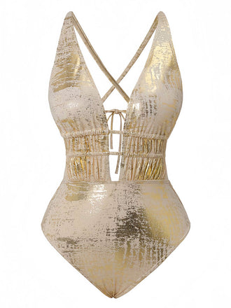 Gold metallic one-piece swimsuit with criss-cross straps on a white background