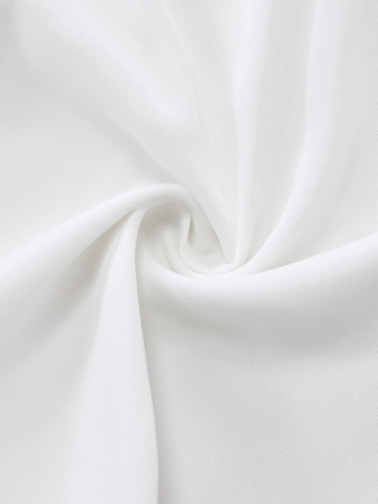 Close-up of white fabric with folds