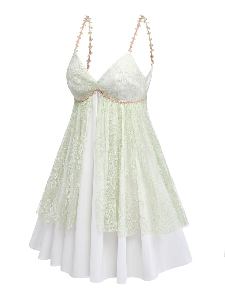 Light green and white lace nightdress with thin Rose straps on a white background