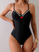 Front view of a model wearing the black one-piece swimsuit, highlighting the vintage-inspired silhouette.
