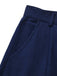 Detailed view of the integrated side seam pocket on the navy blue skirt.