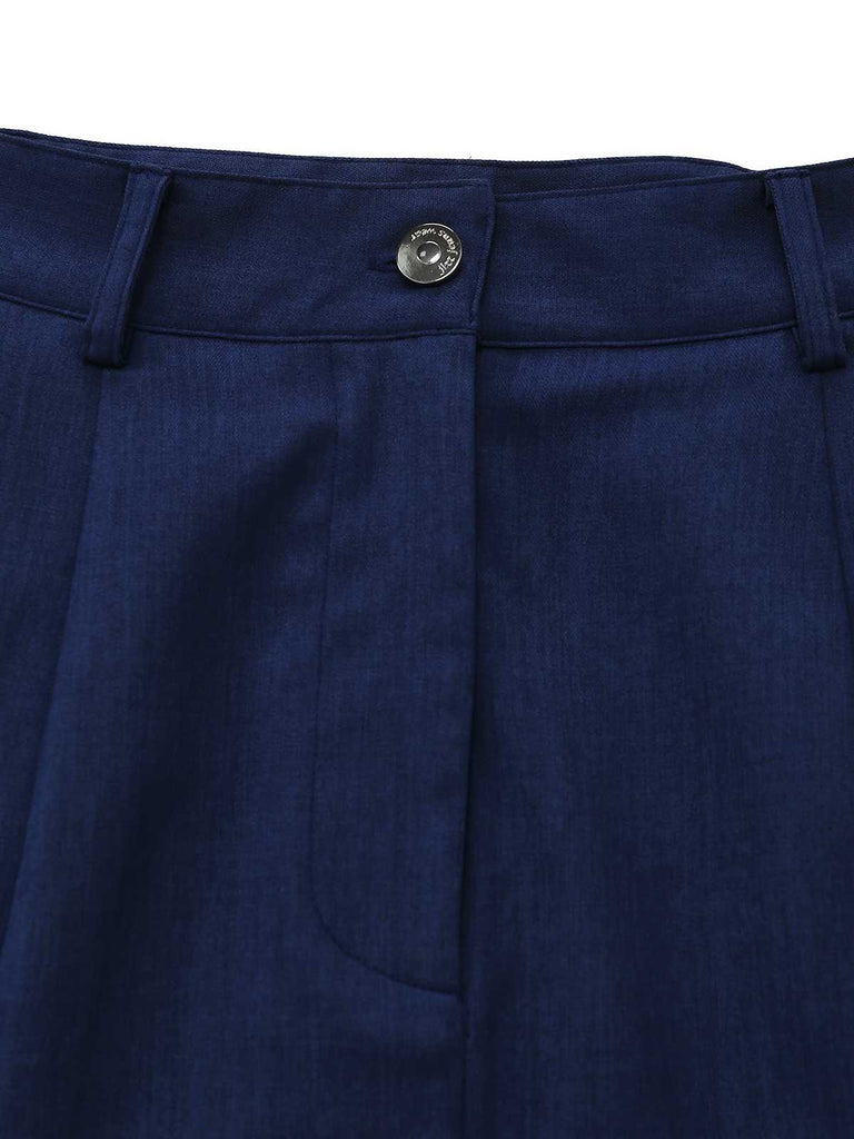 Close-up of the waistband featuring a metallic button and concealed zipper fly.