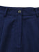 Close-up of the vertical pleat construction near the flared hem of the skirt.