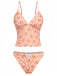Retro orange deep V-neck tankini featuring ditsy floral pattern in 70s style, ideal for summer getaways and vintage-themed pool parties