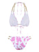 Back view of the pink and white cow print bikini showcasing the gold hardware.