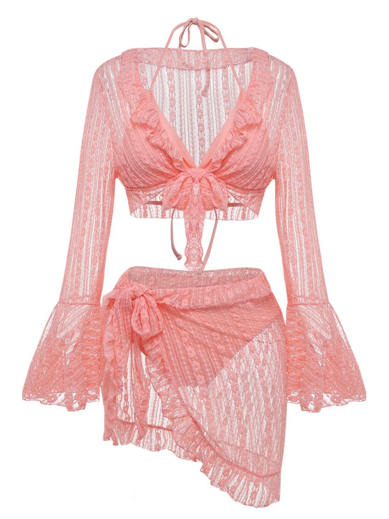 Front view of the pink lace swim set showing the tie-front bell-sleeve cardigan and sarong-style skirt.