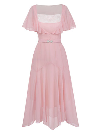 A three-quarter view of the pink chiffon dress highlighting the flutter sleeves and the slim-fit waist with a decorative buckle belt.