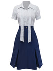 Front view of the coordinated pinstripe blouse and navy blue A-line skirt set.