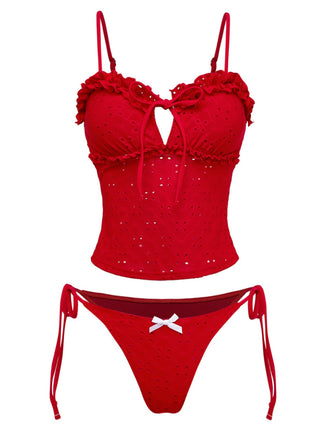 Retro red tankini set featuring intricate embroidery, feminine ruffle accents and side-tie design with classic 1960s charm, ideal for poolside elegance