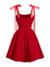 Rear view of the red fit and flare cocktail dress, highlighting the elegant silhouette and shoulder bow detail.