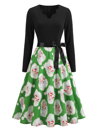 Robe verte de Noël à motif Père Noël et col V festonné Années 1950 - 2