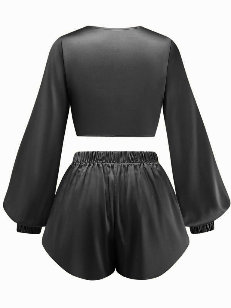 The tie-front silky satin two-piece set shown in classic black for a sophisticated lounge look.