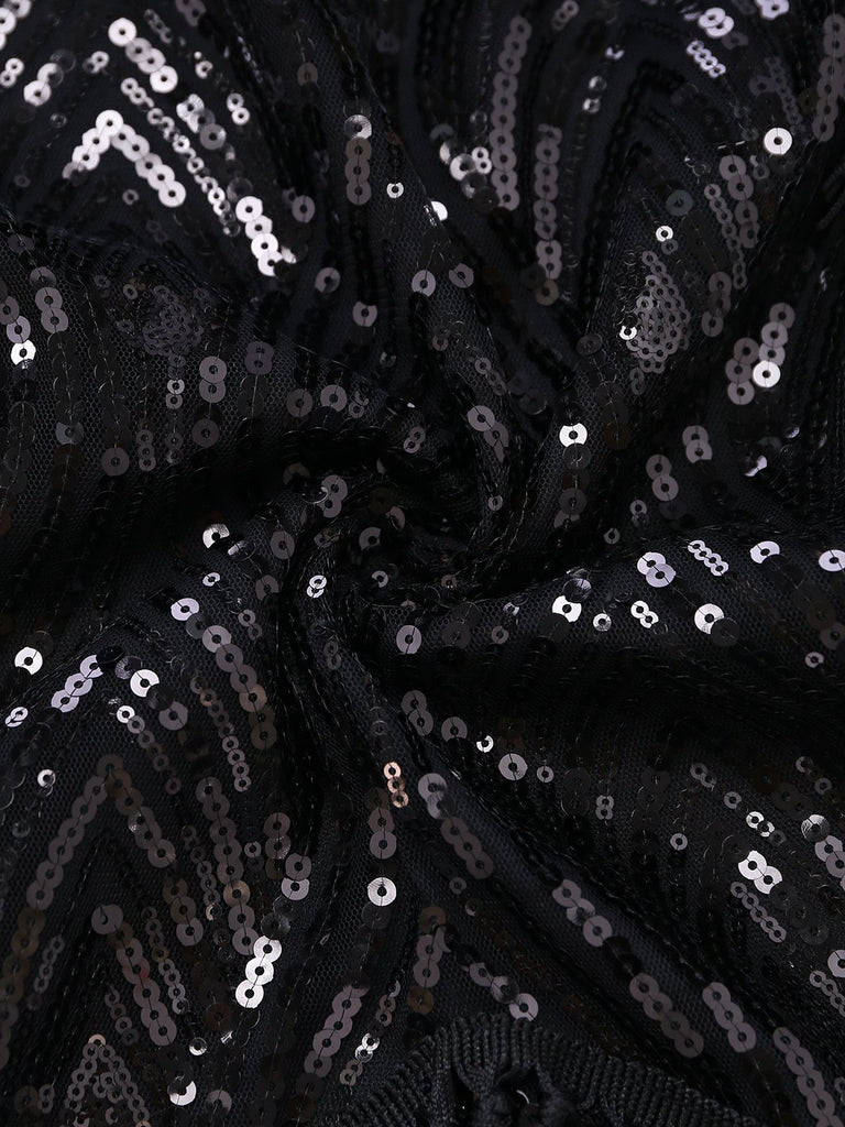 Macro view of the high-density black sequin fabric, highlighting its brilliant shine and craftsmanship.