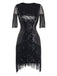 Front view of the black sequin cocktail dress with fringe detailing on the sleeves and skirt.