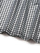 Close-up of black and white checkered fabric on a white background