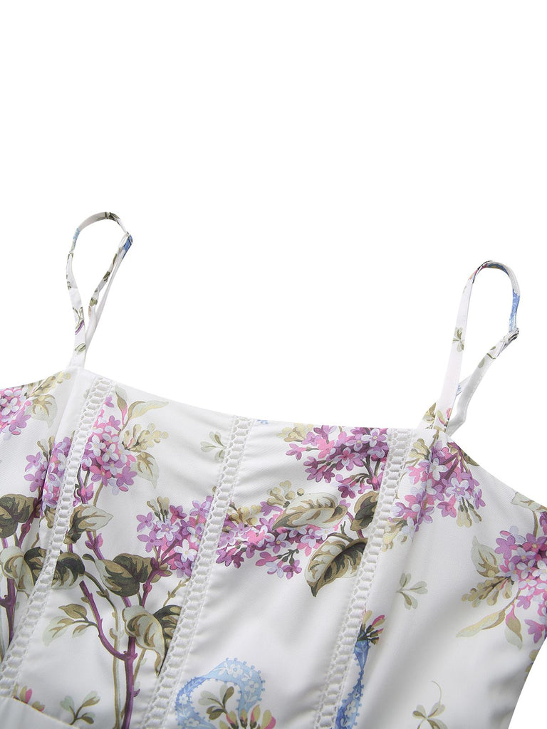Close-up of the sweetheart neckline and thin spaghetti straps on the purple floral print dress.