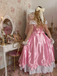 Robe rose à épaules dénudées plissée et ornée d'un nœud en satin années 50