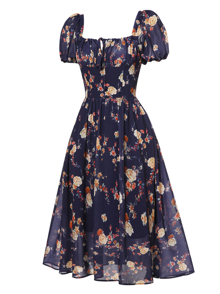 Robe bleu marine à fleurs et manches bouffantes