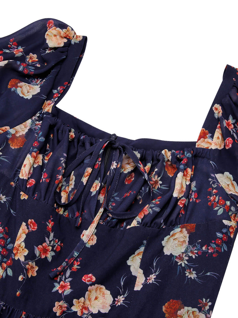 Robe bleu marine à fleurs et manches bouffantes