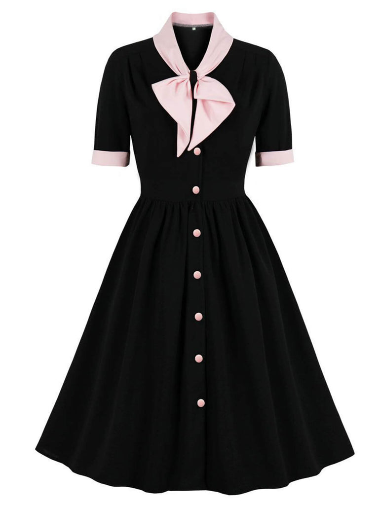 Robe avec nœud à revers et boutons contrastés des années 1940