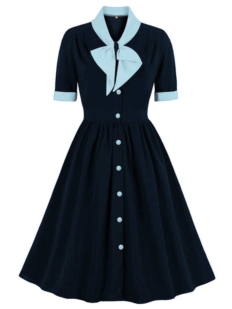 Robe avec nœud à revers et boutons contrastés des années 1940